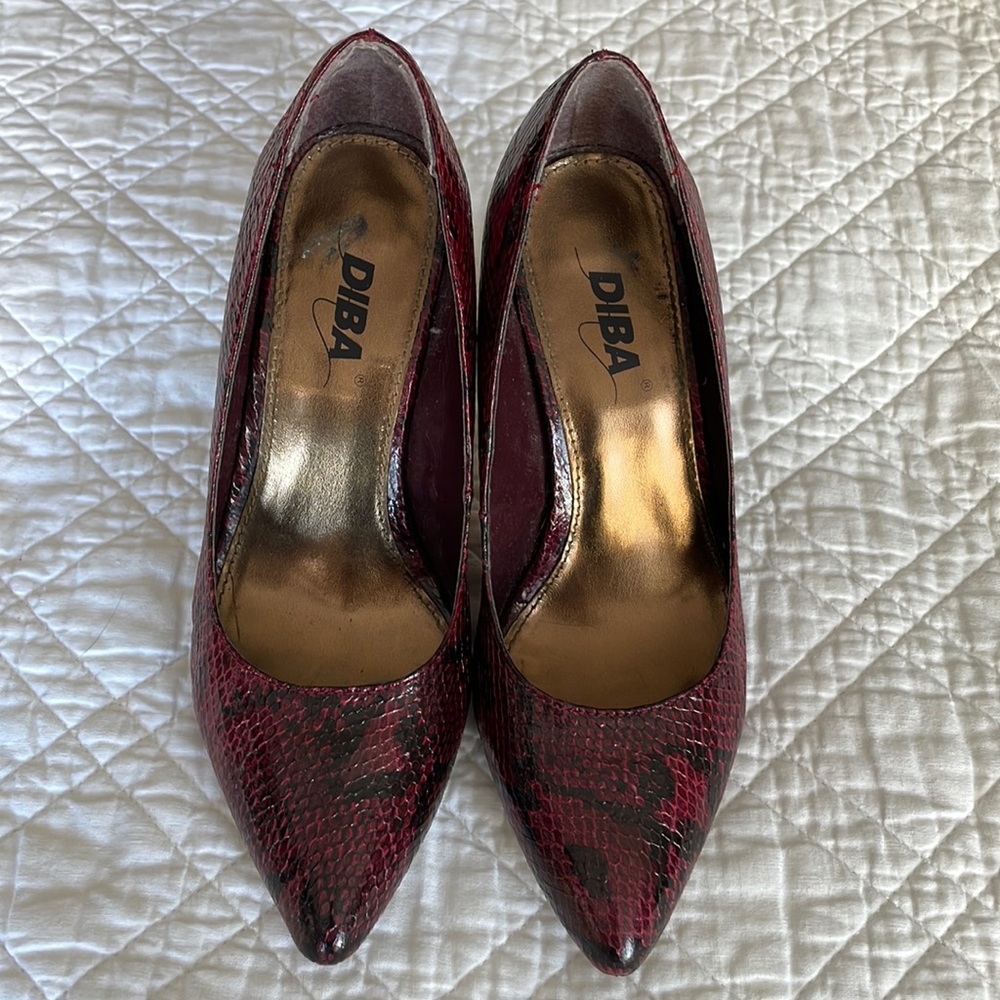 3” snake skin synthetic heels.